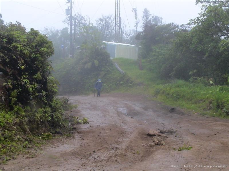 Jan walking in the mist, almost at the top of Cerro Amigo